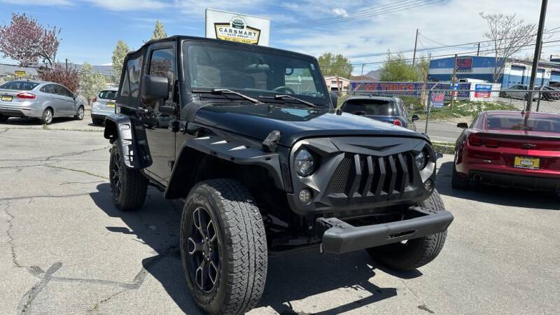 2012 Jeep Wrangler for sale at CarSmart Auto Group in Murray UT