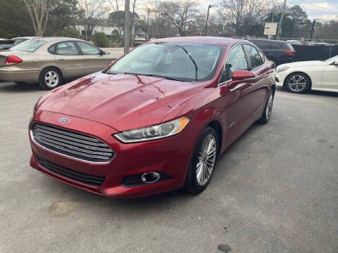 2014 Ford Fusion Hybrid for sale at Oak City Motors in Garner NC