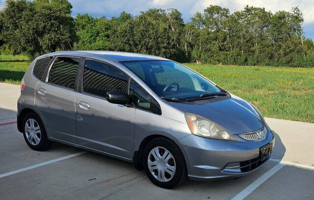 2010 Honda Fit for sale at CAR MARKET AUTO GROUP in Sugar Land, TX