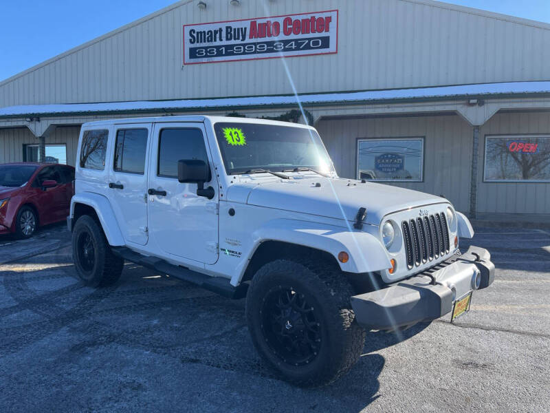 2013 Jeep Wrangler Unlimited for sale at Smart Buy Auto Center in Aurora IL