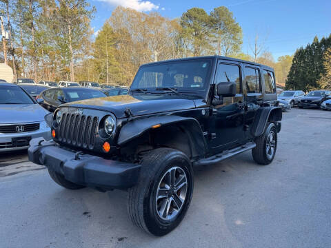 2012 Jeep Wrangler Unlimited for sale at GEORGIA AUTO DEALER LLC in Buford GA
