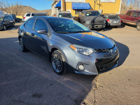 2014 Toyota Corolla for sale at BERKENKOTTER MOTORS in Brighton CO