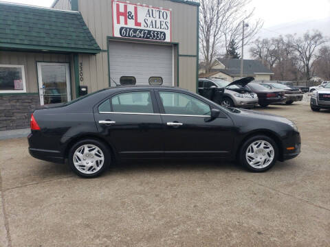 2011 Ford Fusion for sale at H & L AUTO SALES LLC in Wyoming MI