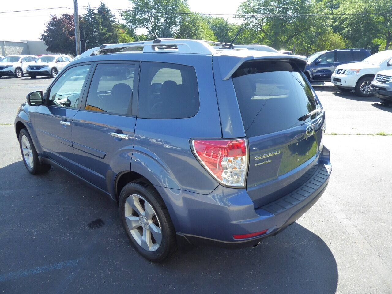 2011 Subaru Forester for sale at Lakeshore Autos in Holland, MI