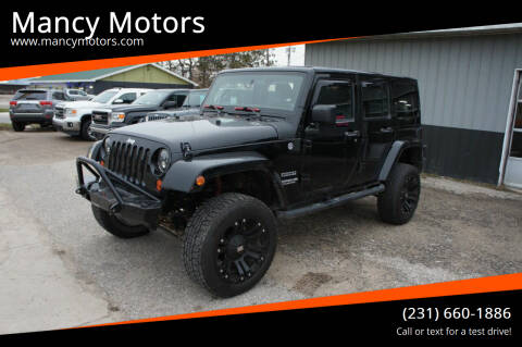 2012 Jeep Wrangler Unlimited for sale at Mancy Motors in Mancelona MI