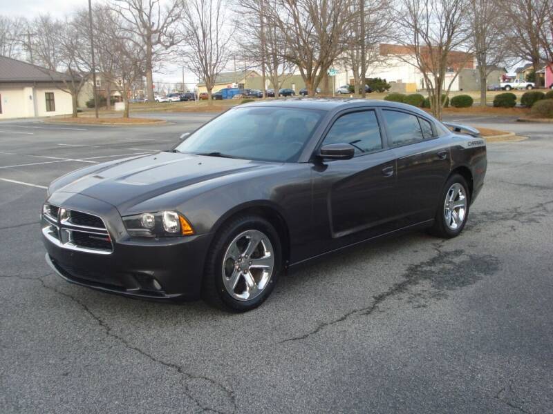 2013 Dodge Charger for sale at Uniworld Auto Sales LLC. in Greensboro NC