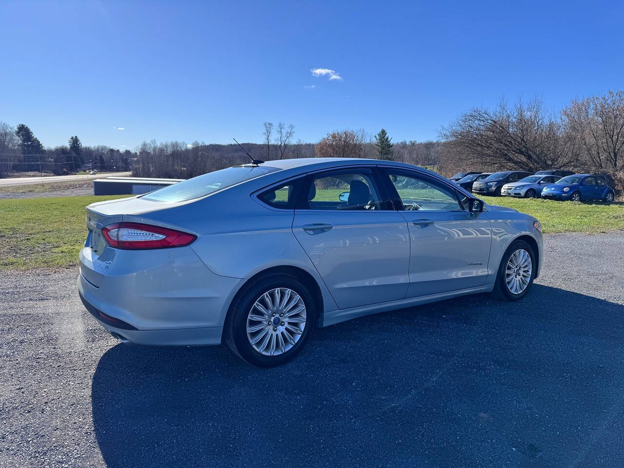 2014 Ford Fusion Hybrid for sale at Riverside Motors in Glenfield, NY