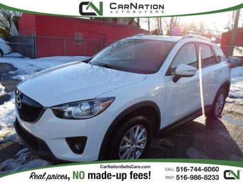 2015 Mazda CX-5 for sale at CarNation AUTOBUYERS Inc. in Rockville Centre NY