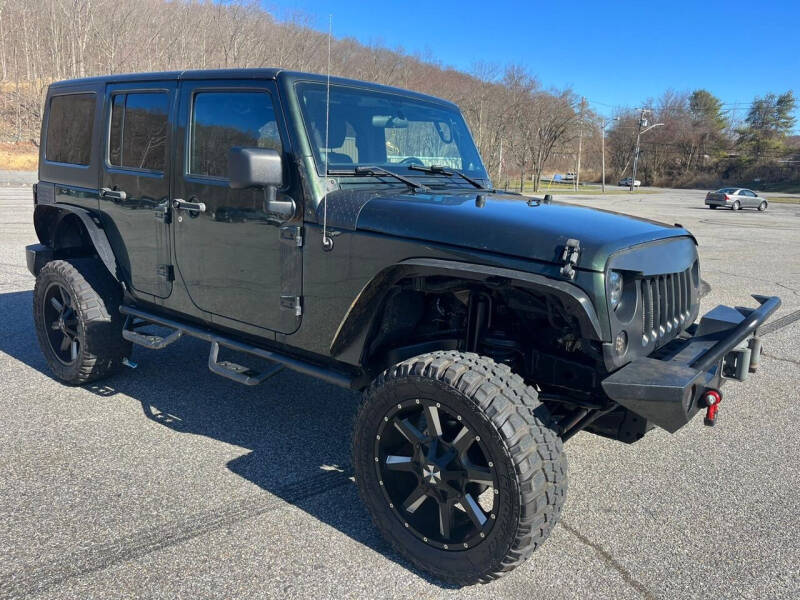 2011 Jeep Wrangler Unlimited for sale at Putnam Auto Sales Inc in Carmel NY