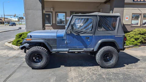 1990 Jeep Wrangler for sale at AUTO WORLD AUTO SALES in Rapid City SD