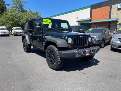 2012 Jeep Wrangler Unlimited for sale at SWIFT AUTO SALES INC in Salem OR
