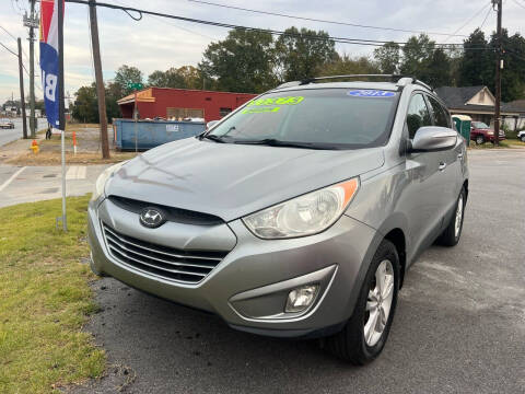 2013 Hyundai Tucson for sale at Cars for Less in Phenix City AL