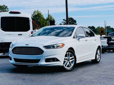 2014 Ford Fusion for sale at LOS PAISANOS AUTO & TRUCK SALES LLC in Norcross GA