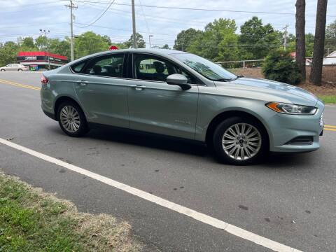 2014 Ford Fusion Hybrid for sale at THE AUTO FINDERS in Durham NC
