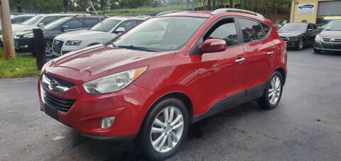 2011 Hyundai Tucson for sale at GEORGIA AUTO DEALER LLC in Buford GA