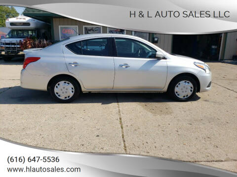 2017 Nissan Versa for sale at H & L AUTO SALES LLC in Wyoming MI