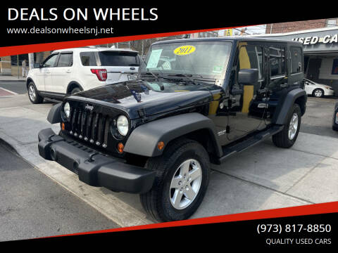 2011 Jeep Wrangler Unlimited for sale at DEALS ON WHEELS in Newark NJ