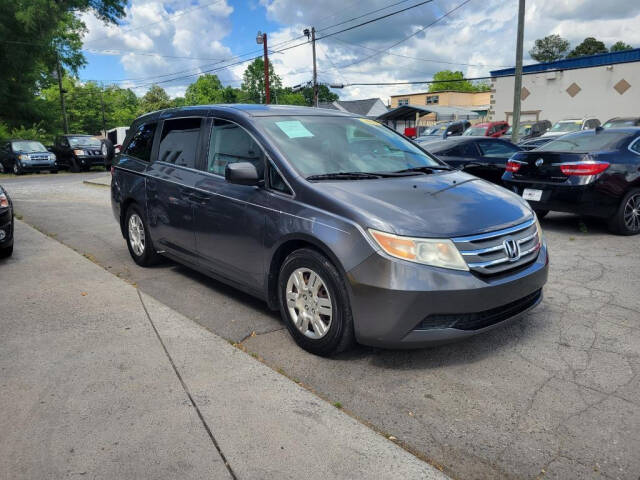 2012 Honda Odyssey for sale at DAGO'S AUTO SALES LLC in Dalton, GA