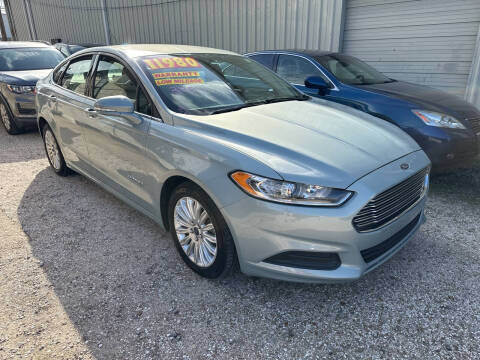 2013 Ford Fusion Hybrid for sale at CHEAPIE AUTO SALES INC in Metairie LA