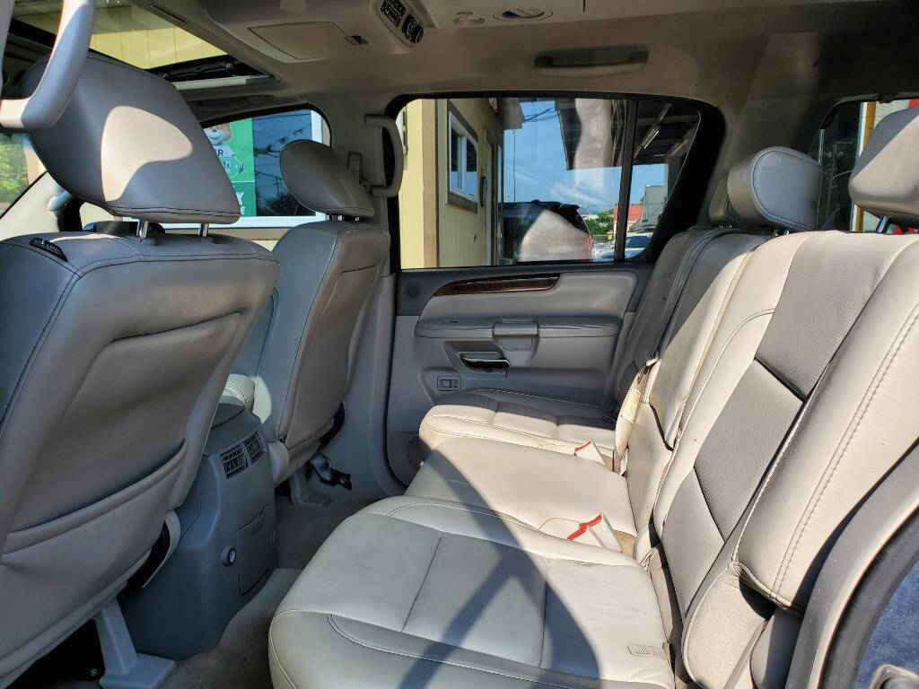 2010 Nissan Armada for sale at DAGO'S AUTO SALES LLC in Dalton, GA