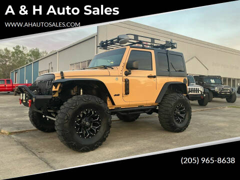 2014 Jeep Wrangler Sport for sale at A & H Auto Sales in Clanton AL
