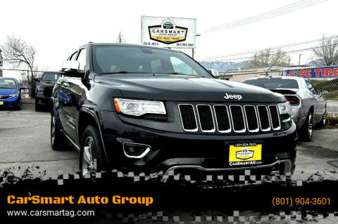 2014 Jeep Grand Cherokee for sale at CarSmart Auto Group in Murray UT