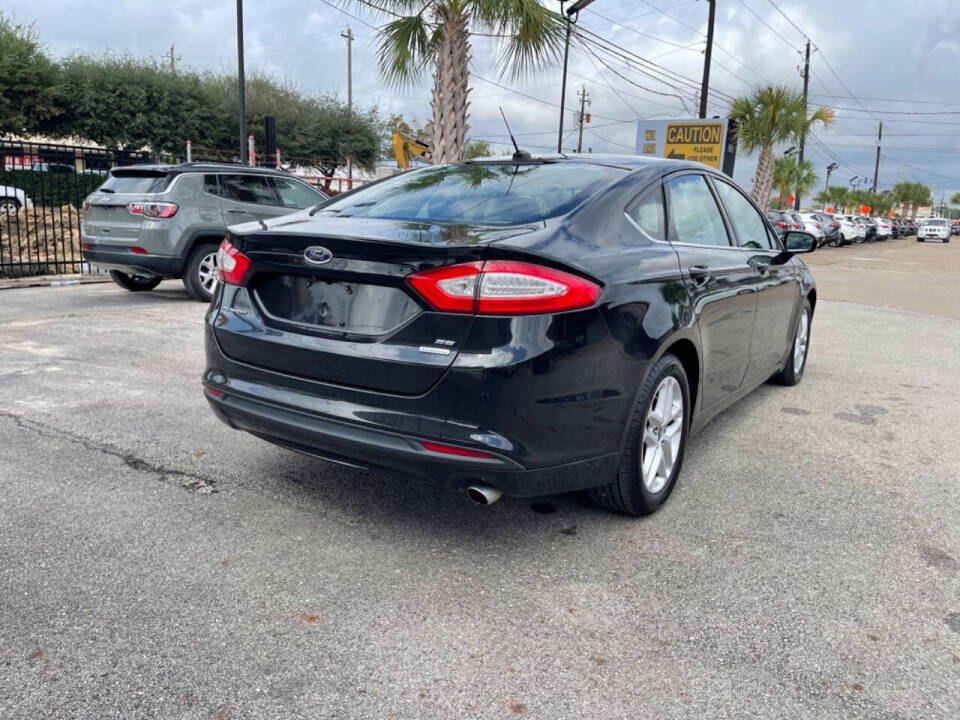 2014 Ford Fusion for sale at SMART CHOICE AUTO in Pasadena, TX