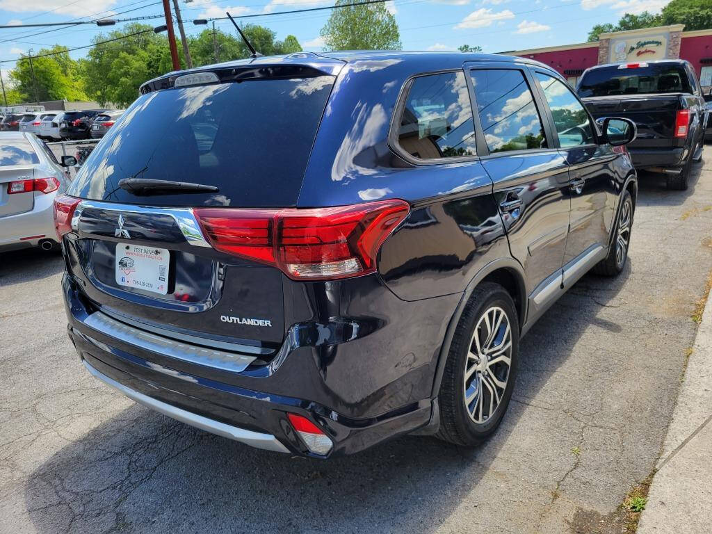 2016 Mitsubishi Outlander for sale at DAGO'S AUTO SALES LLC in Dalton, GA