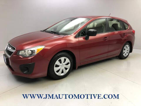 2014 Subaru Impreza for sale at J & M Automotive in Naugatuck CT