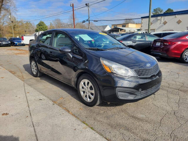 2015 Kia Rio for sale at DAGO'S AUTO SALES LLC in Dalton, GA