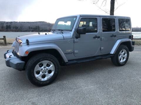 2013 Jeep Wrangler Unlimited for sale at Monroe Auto's, LLC in Parsons TN