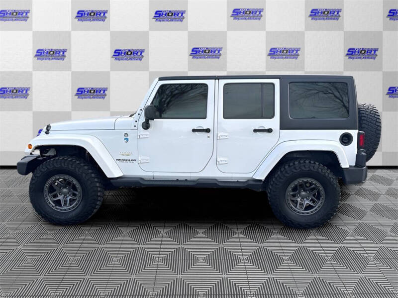 Used 2015 Jeep Wrangler Unlimited Sahara with VIN 1C4BJWEG9FL667865 for sale in Maysville, KY