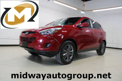 2015 Hyundai Tucson for sale at Midway Auto Group in Addison TX
