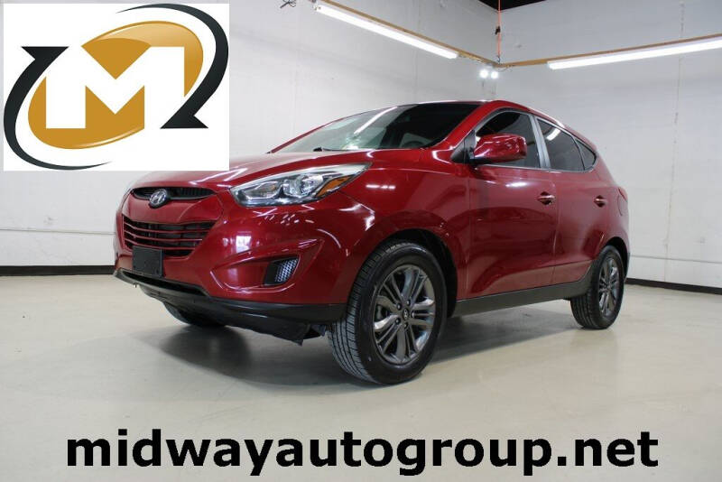 2015 Hyundai Tucson for sale at Midway Auto Group in Addison TX