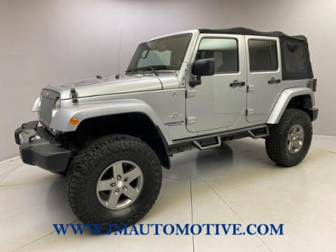 2013 Jeep Wrangler Unlimited for sale at J & M Automotive in Naugatuck CT