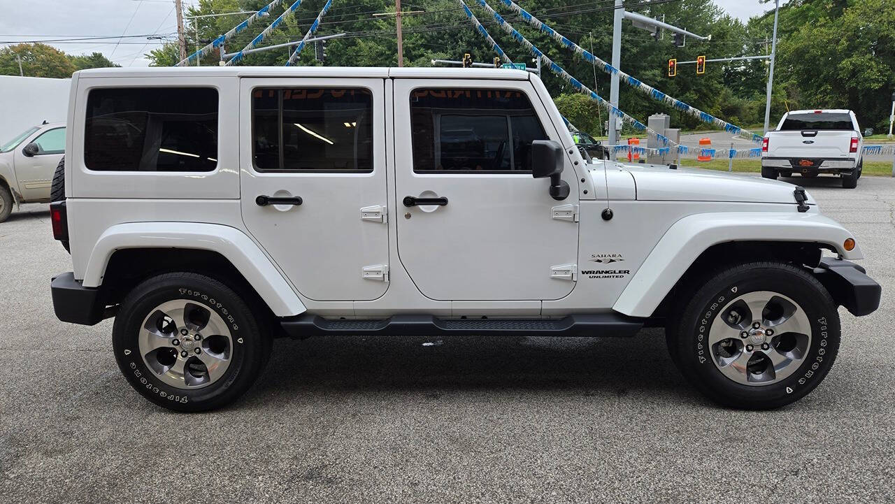 2016 Jeep Wrangler Unlimited for sale at North Ridge Auto Center LLC in Madison, OH