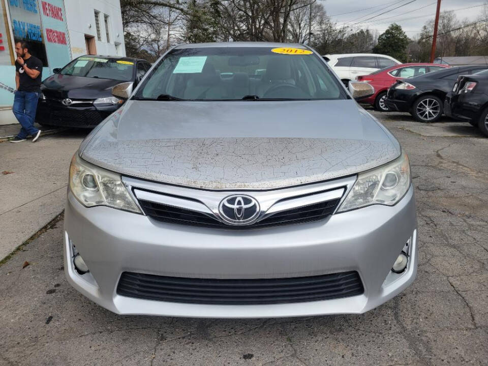 2012 Toyota Camry for sale at DAGO'S AUTO SALES LLC in Dalton, GA