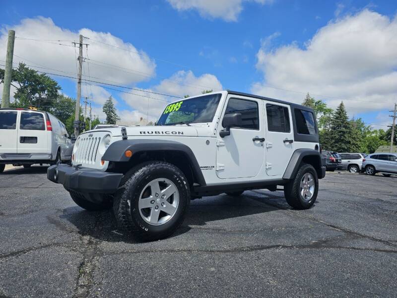 2011 Jeep Wrangler Unlimited for sale at DALE'S AUTO INC in Mount Clemens MI