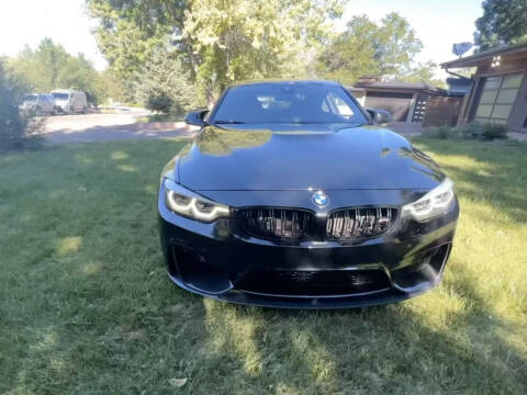 2019 BMW M4 for sale at THE MANHATTAN AUTO GROUP in Lakewood CO