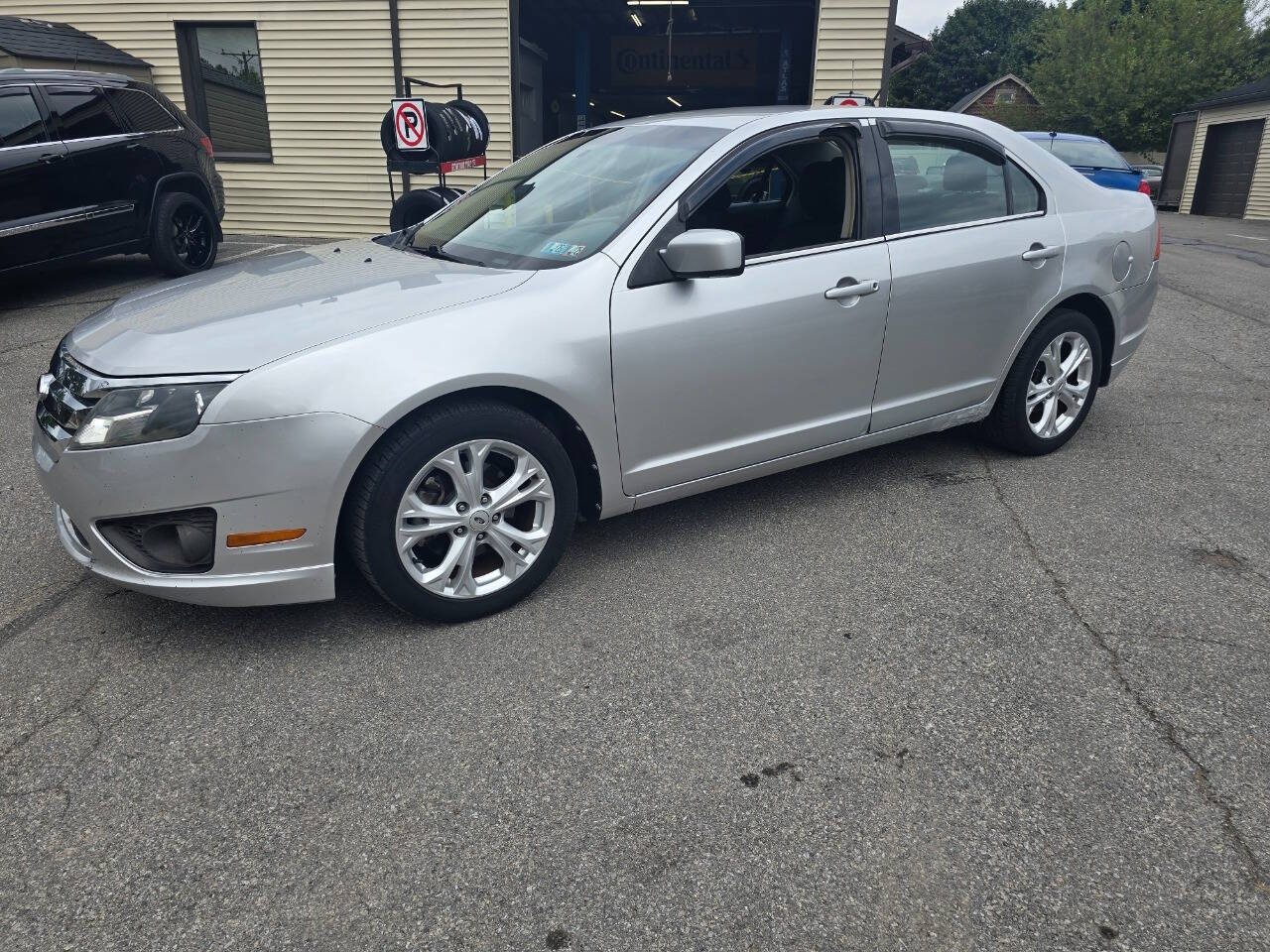 2012 Ford Fusion for sale at QUEENSGATE AUTO SALES in York, PA