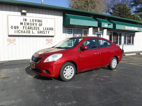 2013 Nissan Versa for sale at GRESTY AUTO SALES in Loves Park IL