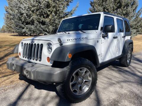 2013 Jeep Wrangler Unlimited for sale at BELOW BOOK AUTO SALES in Idaho Falls ID