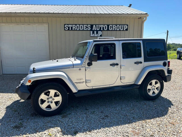 2012 Jeep Wrangler Unlimited for sale at STRODES AUTO GROUP LLP in Malta, OH