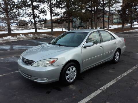 2004 Toyota Camry for sale at QUEST MOTORS in Englewood CO