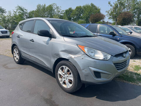 2011 Hyundai Tucson for sale at HEDGES USED CARS in Carleton MI