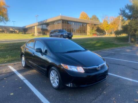 2012 Honda Civic for sale at QUEST MOTORS in Englewood CO