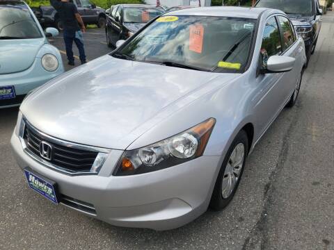 2009 Honda Accord for sale at Howe's Auto Sales in Lowell MA
