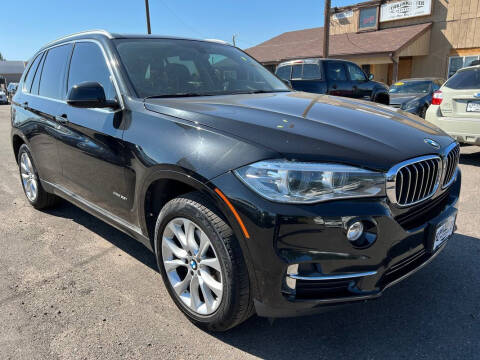 2014 BMW X5 for sale at BERKENKOTTER MOTORS in Brighton CO