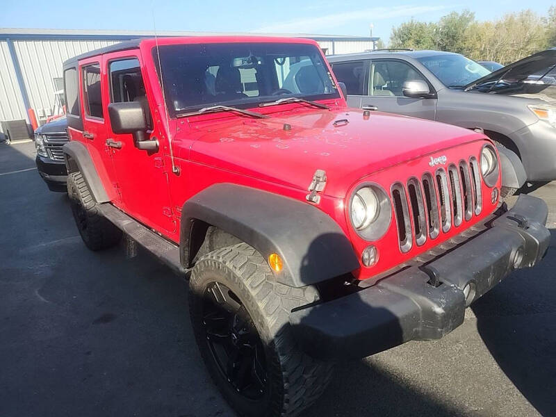 2014 Jeep Wrangler Unlimited for sale at Memo's Auto Sales in Houston TX