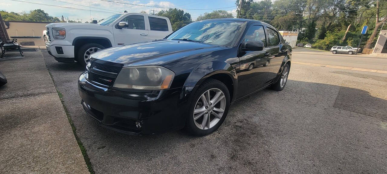 2013 Dodge Avenger for sale at Cars For Less in Clarksville, TN